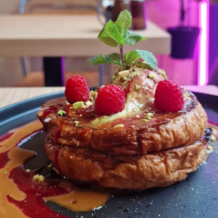 Crème Brûlée caramélised brioche french toast with pistachio marscapone & raspberry sauce